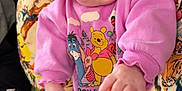 Wrenley joined the competition — help win amazing prizes! baby, infant, child, pink_clothing, winnie_the_pooh, blue_eyes, tongue_out, smile, close_up, portrait, hand, feet, patterned_blanket, pillow, sofa, couch, casual, home_interior, cute, outfit