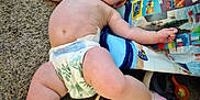Winters joined the competition — help win amazing prizes! baby, diaper, carpet, sneakers, toy_bag, floor, infant, barefoot, child, indoor, curious, relaxed, blue_eyes, chubby, casual, playtime, home, cute, person, young