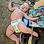 baby, diaper, carpet, sneakers, toy_bag, floor, infant, barefoot, child, indoor, curious, relaxed, blue_eyes, chubby, casual, playtime, home, cute, person, young
