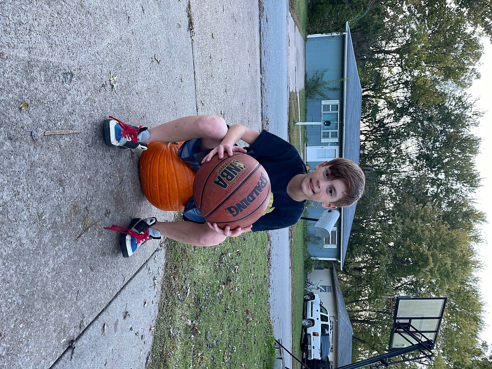 Karsin is registered to the contest to win money with this photo: ball, ball_game, basketball, basketball_court, basketball_hoop, basketball_moves, basketball_player, elbow, leisure, person, player, shorts, sports, sports_equipment, sports_uniform, sportswear, streetball, team_sport, tree, window