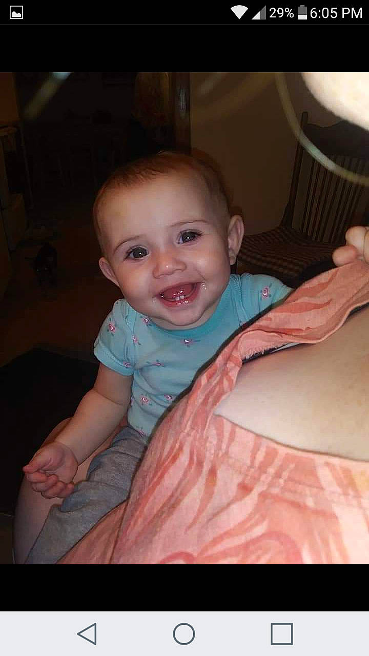 Nyla is registered to the contest to win money with this photo: arm, baby, cheek, child, chin, eye, face, facial_expression, finger, fun, head, iris, joy, lip, mouth, neck, nose, person, sitting, skin