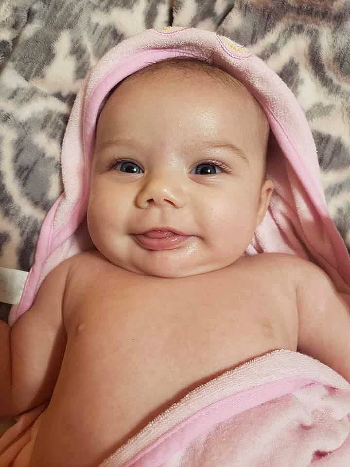 Layla is registered to the contest to win money with this photo: baby, cheek, child, chin, close_up, comfort, eyebrow, eyelash, facial_expression, fun, happy, iris, lip, neck, nose, person, pink, skin, smile, thumb