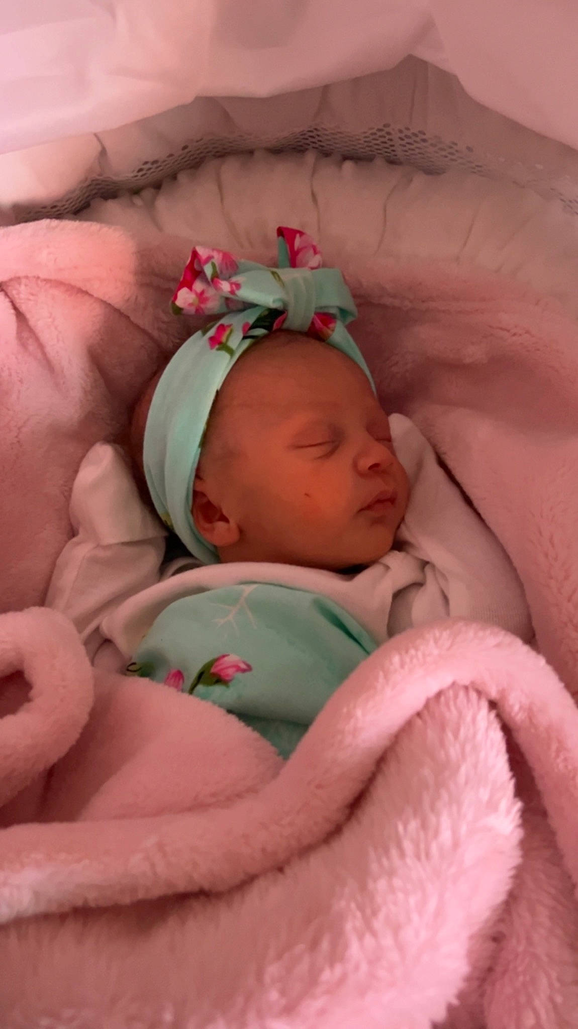 Aniyah is registered to the contest to win money with this photo: arm, baby, baby_products, baby_sleeping, baby_toddler_clothing, bedtime, cheek, comfort, eye, face, hand, head, headgear, human_body, linens, lip, mouth, person, pink, skin