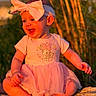 baby, child, infant, portrait, smiling, laughing, outdoor, nature, sunset, warm_lighting, headband, bow, dress, pink_clothing, sitting, tree_stump, wood, forest, baby_fashion, happy