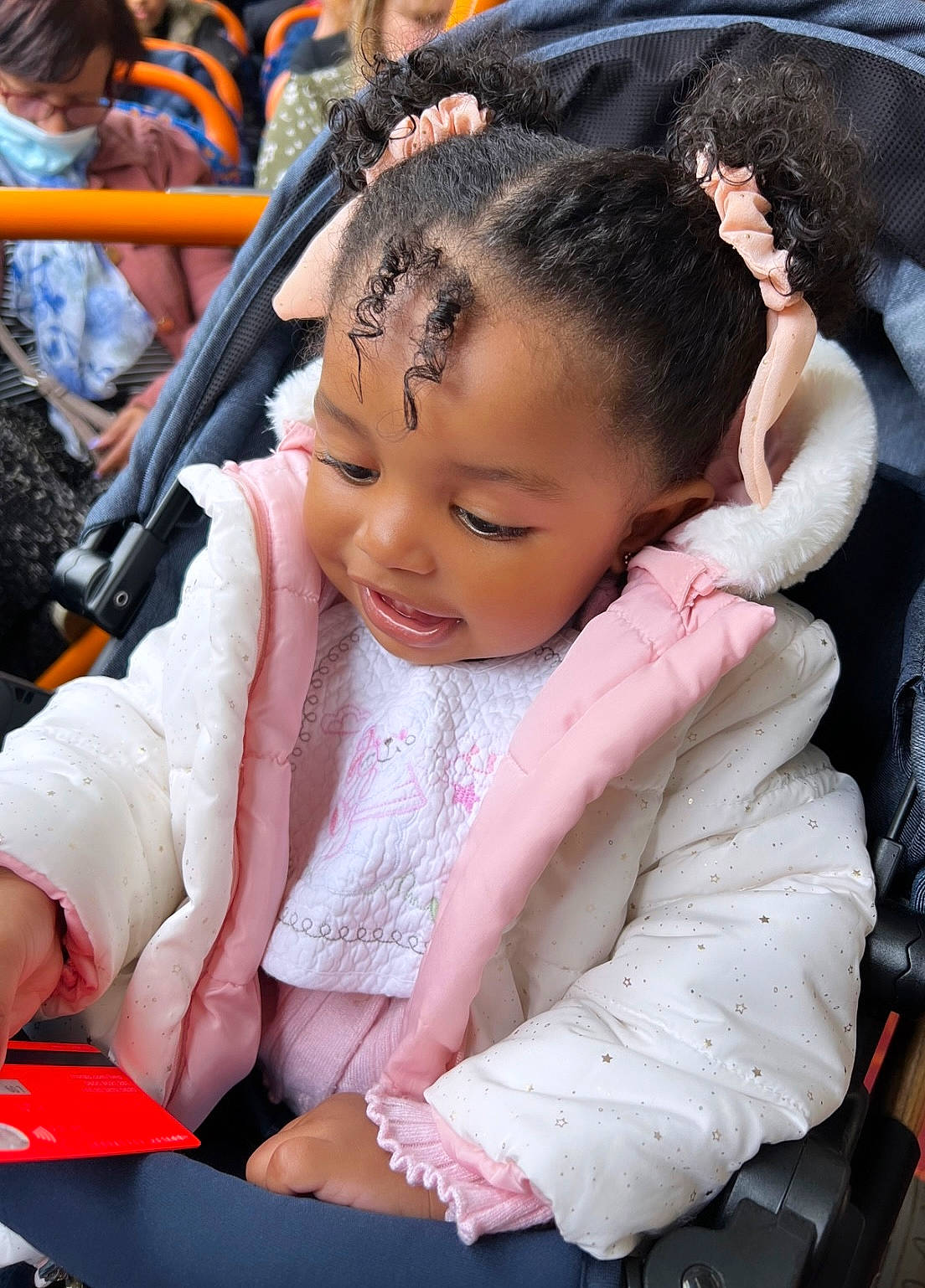 Kamila is registered to the contest to win money with this photo: baby, black_hair, cheek, child, event, facial_expression, fashion, fun, hairstyle, happy, head, leisure, mammal, person, product, sitting, skin, snapshot, toddler, tradition