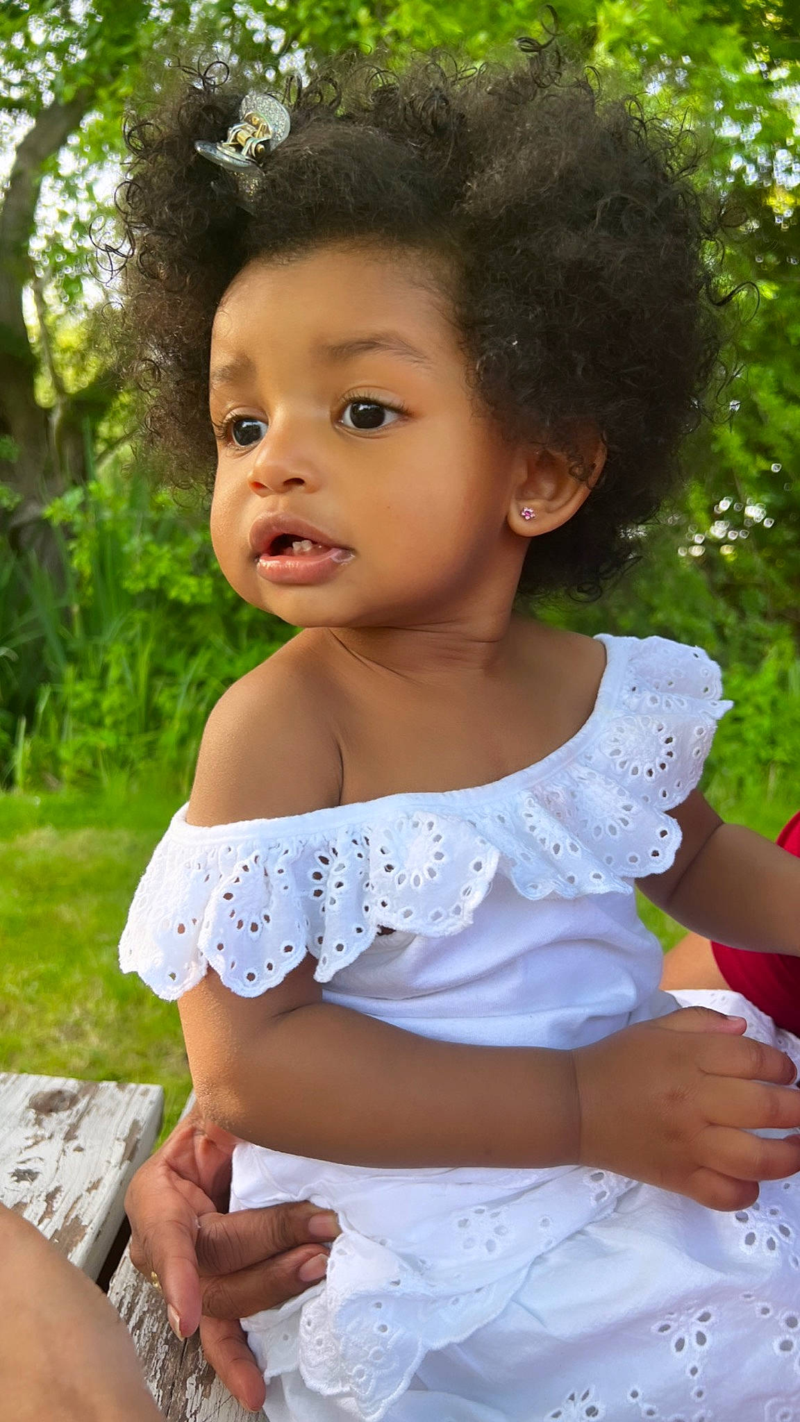 Kamila is registered to the contest to win money with this photo: baby, baby_toddler_clothing, botany, child, day_dress, dress, embellishment, formal_wear, grass, hairstyle, happy, pattern, person, pink, plant, ruffle, sitting, skin, sleeve, toddler