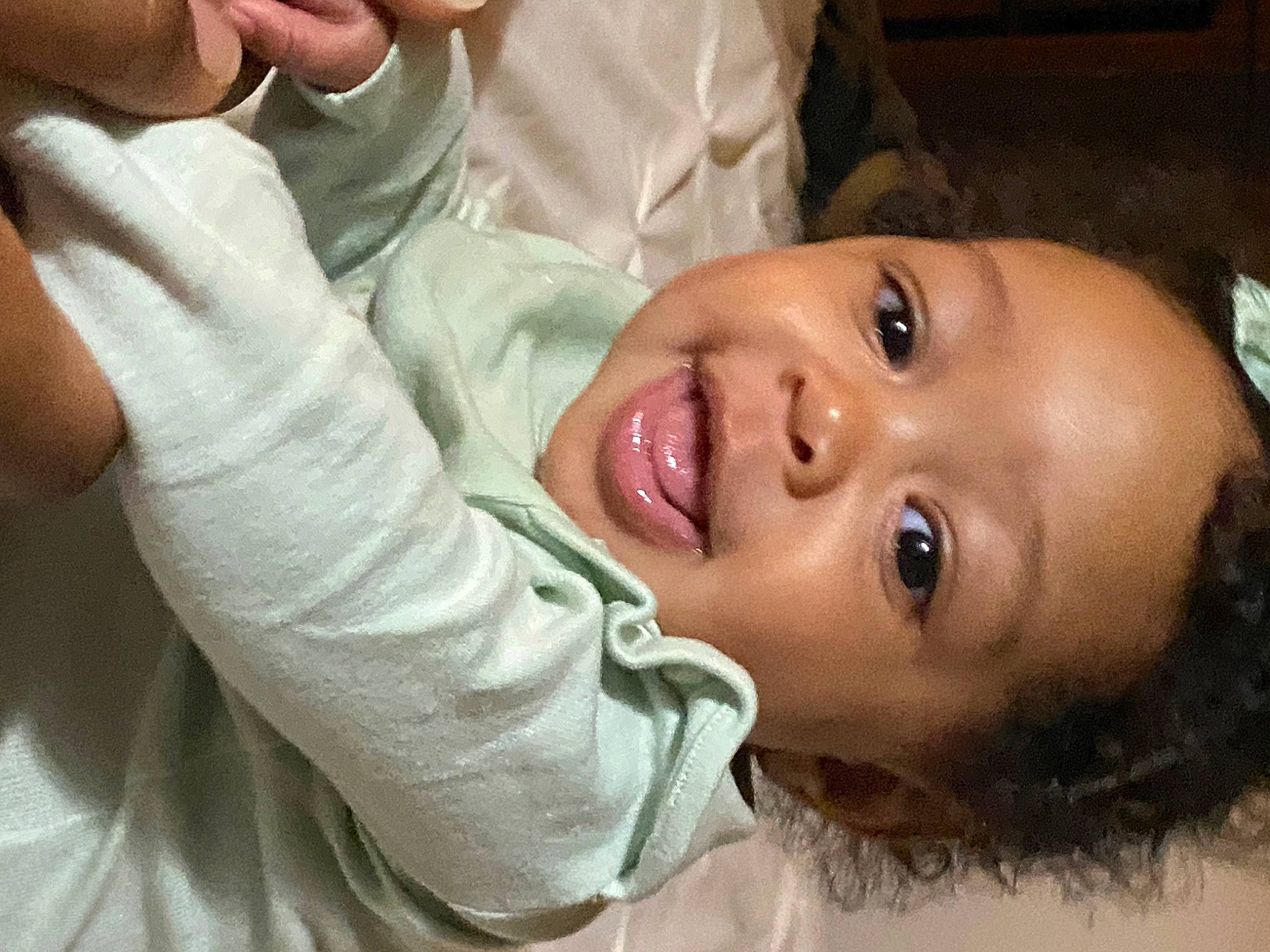 Ava is registered to the contest to win money with this photo: cheek, ear, eyebrow, eyelash, finger, forehead, gesture, hand, happy, iris, jaw, lip, mouth, neck, nose, person, plant, skin, smile, tooth