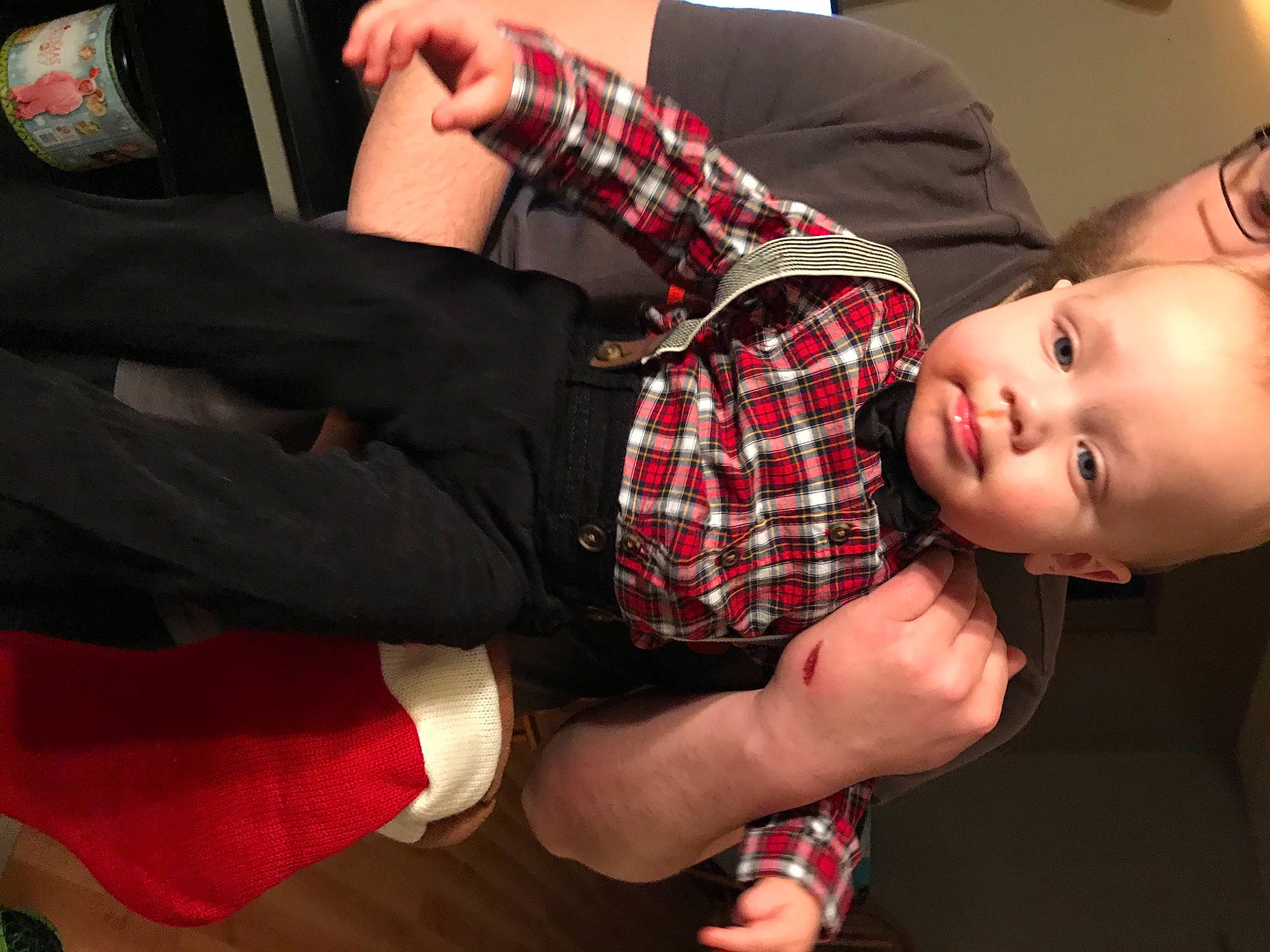 Odin is registered to the contest to win money with this photo: arm, baby, baby_toddler_clothing, bracelet, carmine, design, elbow, finger, hand, lap, nail, pattern, person, plaid, sock, tartan, textile, thumb, wrist