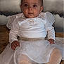 baby, child, infant, white_dress, sparkly, tights, sitting, portrait, face, red_eye, cute, hands, background, clouds, soft_lighting, expression, floor, clothing, baby_fashion, indoor