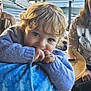 adult, boat, casual_clothing, child, closeup, curly_hair, dock, family, finger_in_mouth, indoor, natural_light, person, phone, portrait, purple_sweater, relaxed, smiling, table, toddler, water