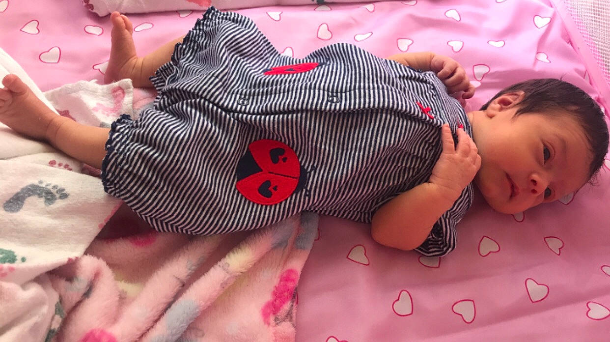 Khalessi is registered to the contest to win money with this photo: baby, baby_toddler_clothing, bedtime, cheek, child, linens, mouth, nap, nap_mat, person, pink, sleep, textile, toddler