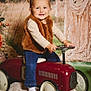 Maelle a rejoint le concours — aidez-le/la à gagner de superbes lots ! blue_jeans, brown_vest, child, cute, decor, fabric_pillow, floral_background, green_grass, indoor, pigtails, playful, portrait, smiling, soft_lighting, steering_wheel, toddler, toy_car, vintage, white_sock, young_child