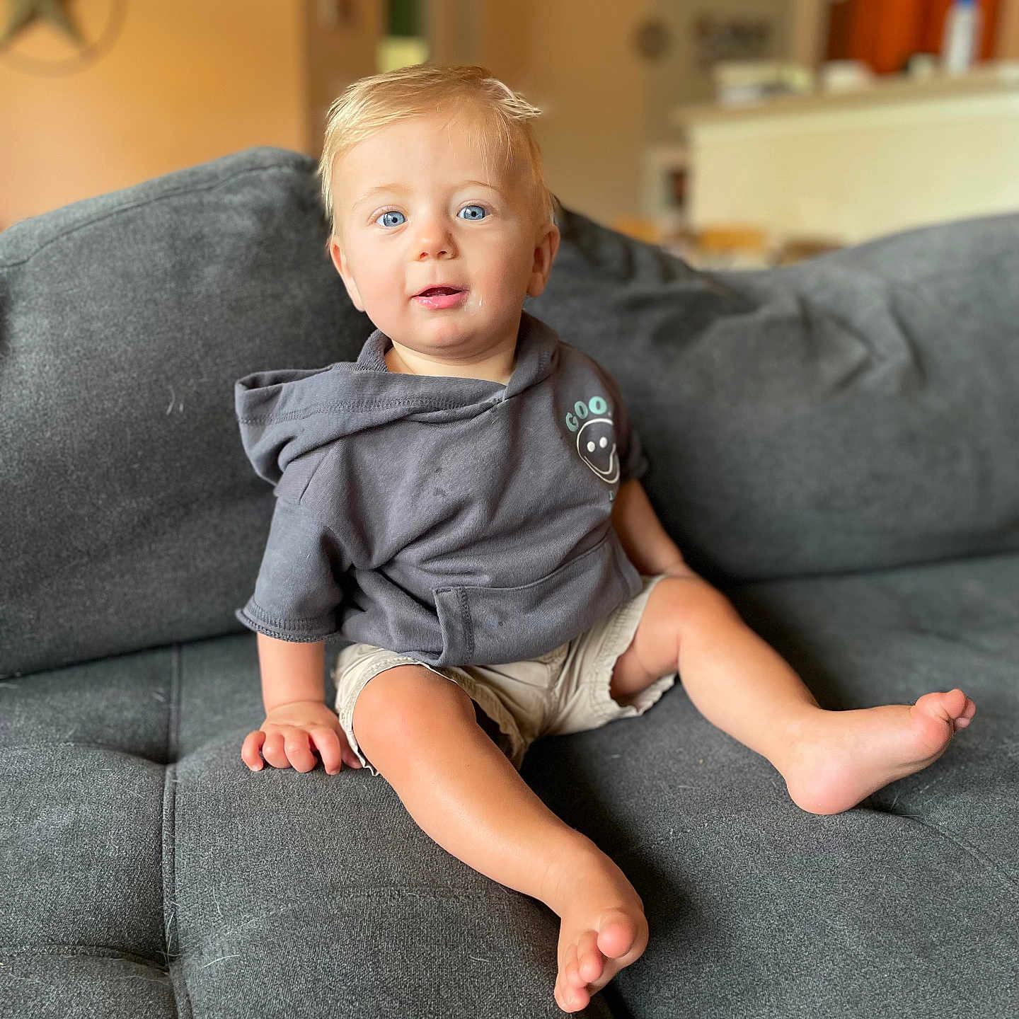 Nathan joined the competition — help win amazing prizes! baby, blonde, bodypart, clothing, couch, cushion, face, finger, furniture, hair, hand, happy, head, homedecor, pants, person, photography, portrait, shorts, sitting
