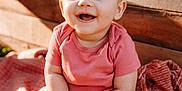 Wrennley is registered to the contest to win money with this photo: baby, child, smiling, sitting, pumpkin, blanket, headband, bow, pink_shirt, floral_pants, boots, wooden_background, fall, autumn, cute, outdoor, portrait, happy, hands, texture