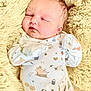 Stetson is registered to the contest to win money with this photo: baby, newborn, sleeping, infant, onesie, animal_print, mitten, blanket, soft_texture, cozy, cute, face, peaceful, child, closeup, portrait, indoor, rest, warm, comfort