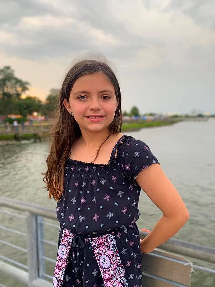 Kaitlyn is registered to the contest to win money with this photo: cloud, flash_photography, fun, hairstyle, happy, joy, lake, leisure, neck, people_in_nature, person, pink, shoulder, sky, sleeve, smile, standing, street_fashion, travel, tree