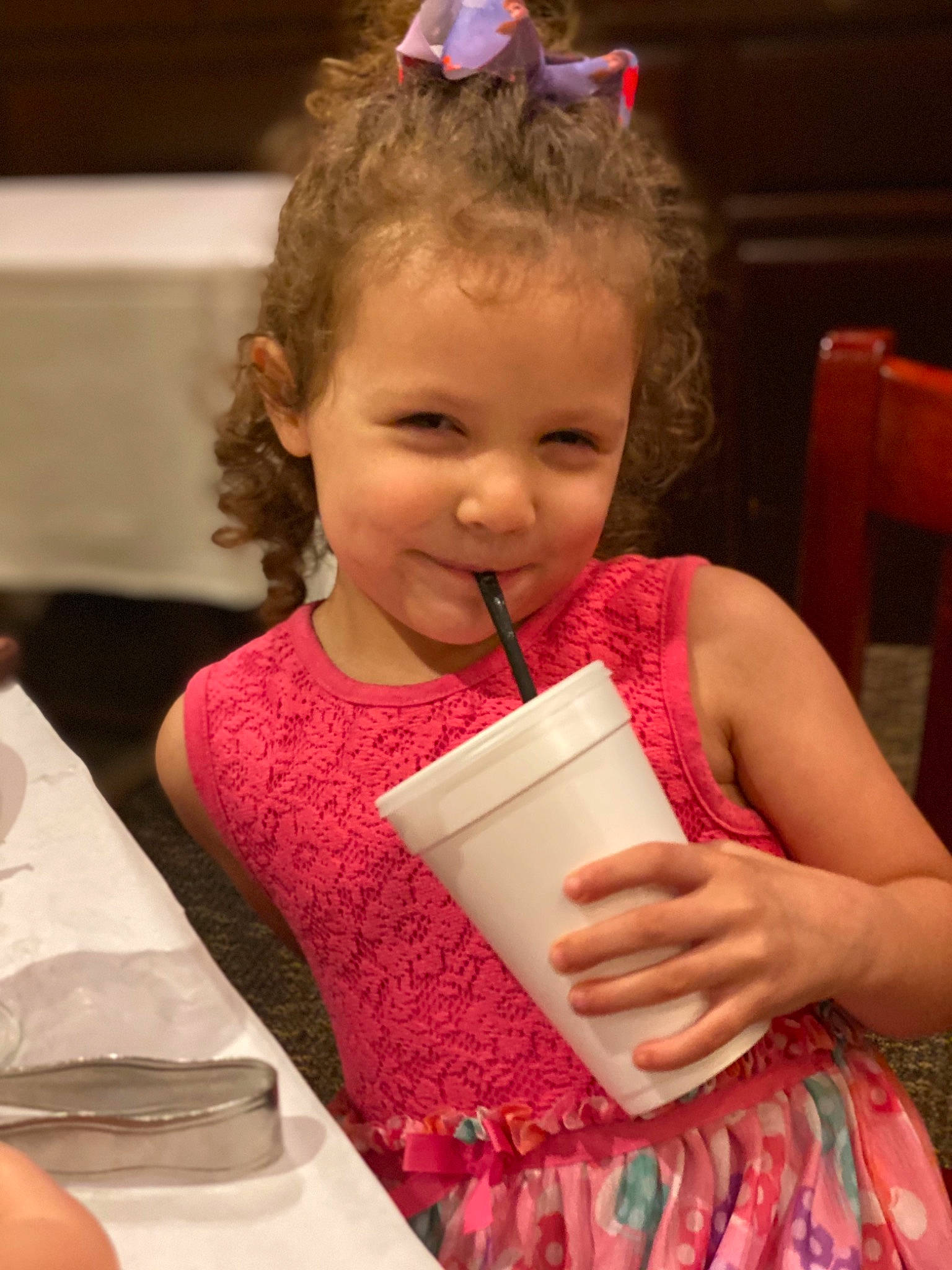 Emma joined the competition — help win amazing prizes! blond, chair, child, dress, drinking, event, facial_expression, formal_wear, fun, hairstyle, happy, joy, magenta, person, pink, plate, sitting, skin, smile, tableware