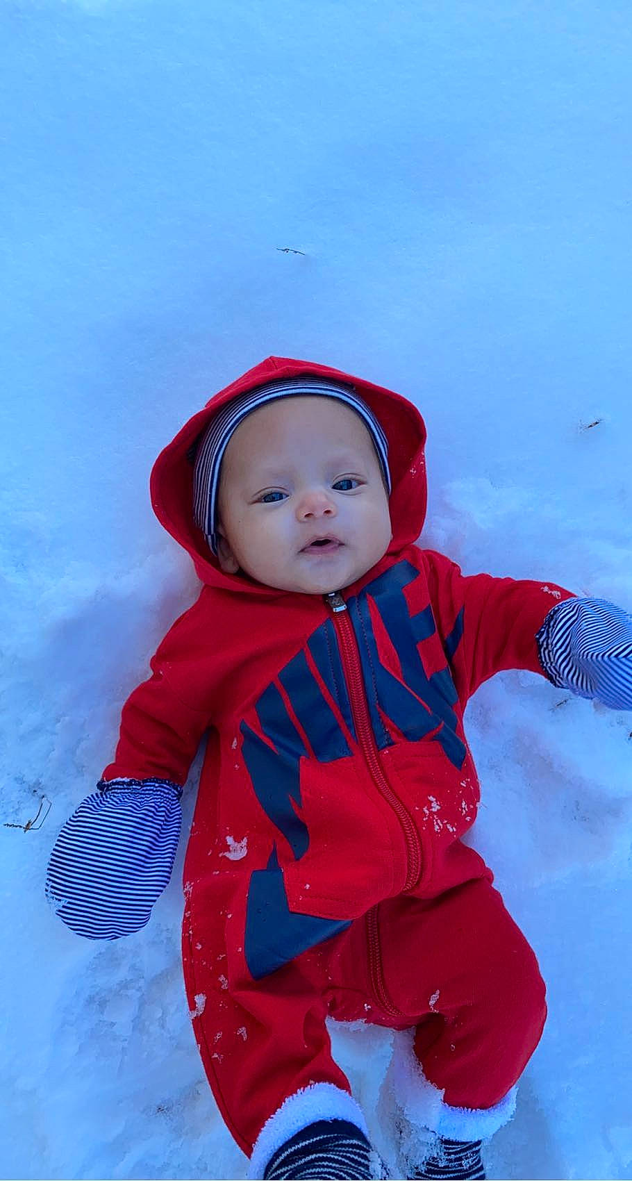 Kylen is registered to the contest to win money with this photo: baby, baby_toddler_clothing, carmine, child, clothing, electric_blue, eye, freezing, fun, happy, headwear, hood, jacket, people_in_nature, person, personal_protective_equipment, playing_in_the_snow, recreation, sleeve, snow