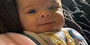 Kalen is registered to the contest to win money with this photo: baby, bib, blanket, bodypart, cushion, face, finger, furniture, hand, happy, head, homedecor, newborn, person, photography, portrait, quilt, smile, towel