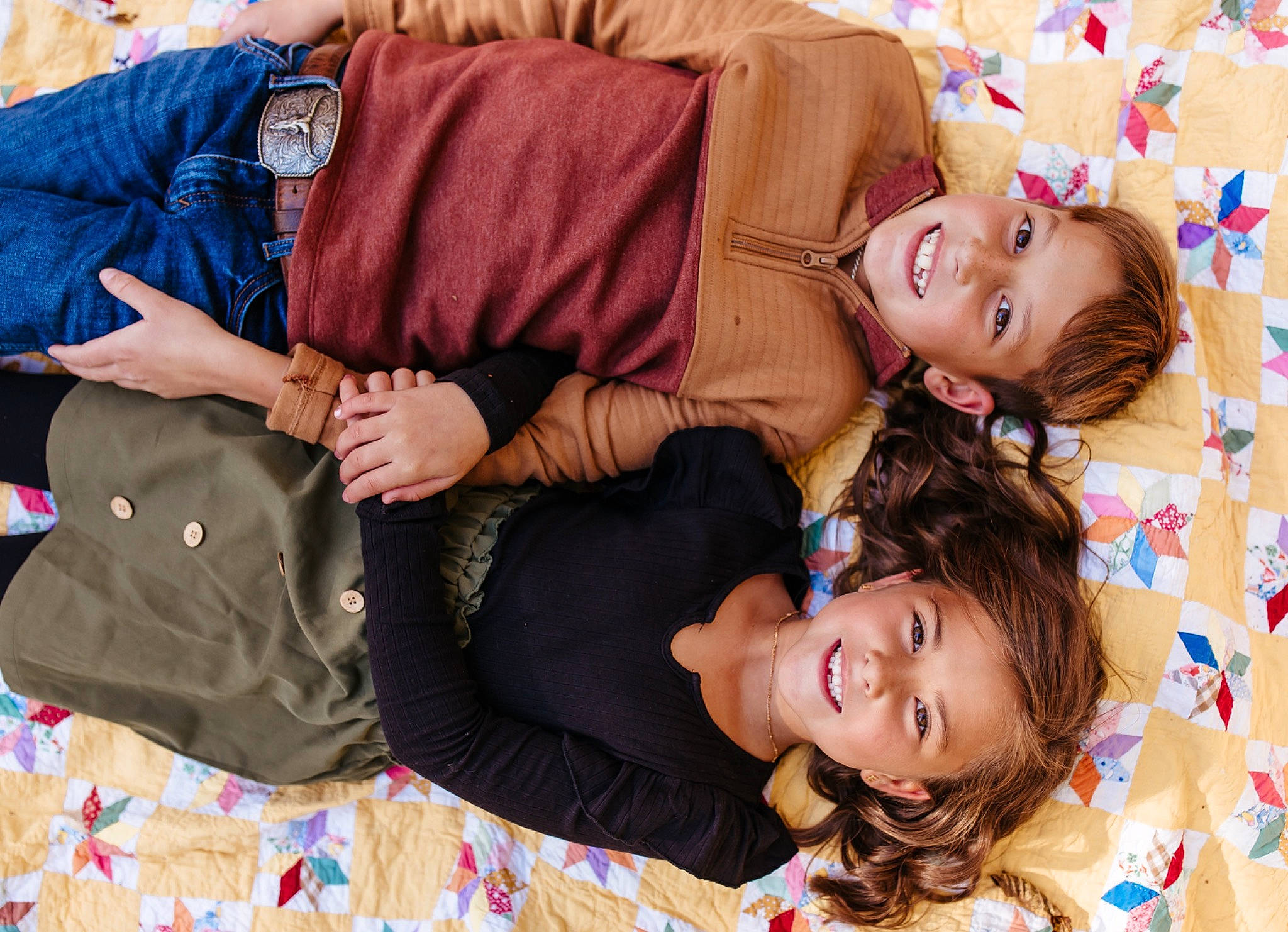 Emrie is registered to the contest to win money with this photo: child, comfort, event, facial_expression, fun, happy, interaction, joy, lap, leisure, magenta, pattern, people, person, room, sitting, smile, textile, thigh, tree