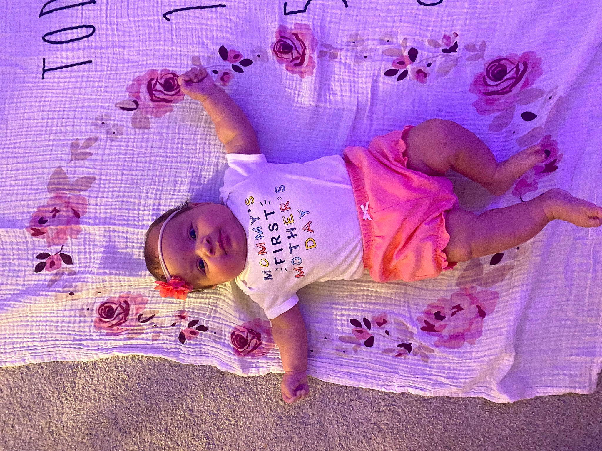 Eliyanah is registered to the contest to win money with this photo: baby, baby_products, baby_toddler_clothing, child, event, font, handwriting, headwear, linens, magenta, pattern, person, petal, pink, purple, room, sleeve, textile, toddler, violet