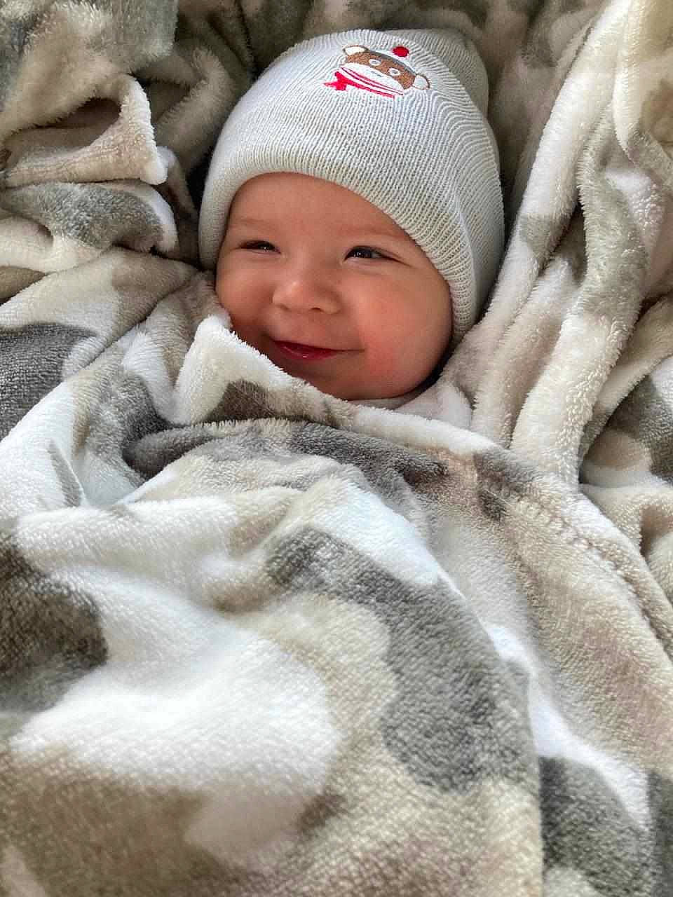 William joined the competition — help win amazing prizes! baby, baby_products, baby_sleeping, baby_toddler_clothing, beanie, cap, carmine, child, comfort, face, fur, grey, headwear, knit_cap, linens, person, skin, textile, toddler, white