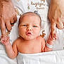 newborn, baby, infant, hand_holding, adult_hands, hospital_wristband, blanket, cartoon_characters, bed, cute, family, parental_love, skin, portrait, closeup, expression, lying_down, baby_face, newborn_baby, tender_moment