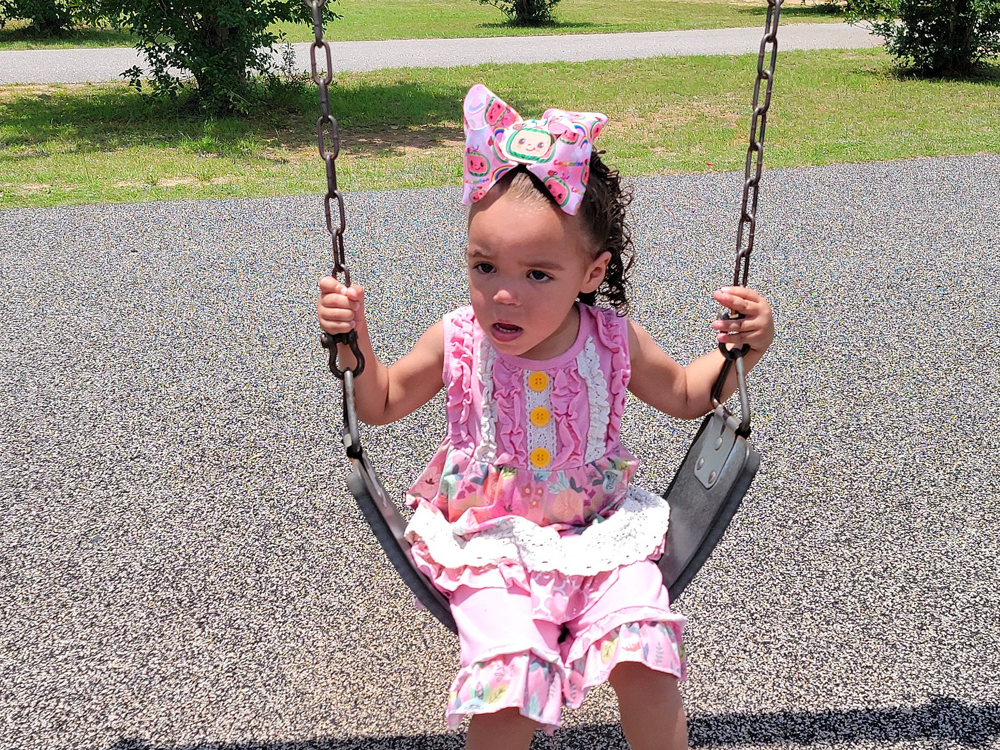 Saraiah joined the competition — help win amazing prizes! baby_toddler_clothing, child, fashion_accessory, fun, grass, happy, jewellery, leaf, leisure, magenta, pattern, person, photograph, pink, plant, play, sitting, sleeve, spring, swing