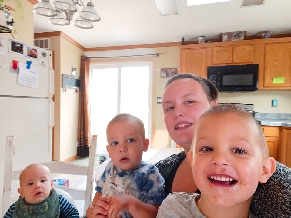 Everett is registered to the contest to win money with this photo: baby, cabinetry, ceiling_fan, cheek, child, event, fun, happy, home_appliance, joy, kitchen_appliance, microwave_oven, person, property, refrigerator, room, sharing, skin, smile, t_shirt