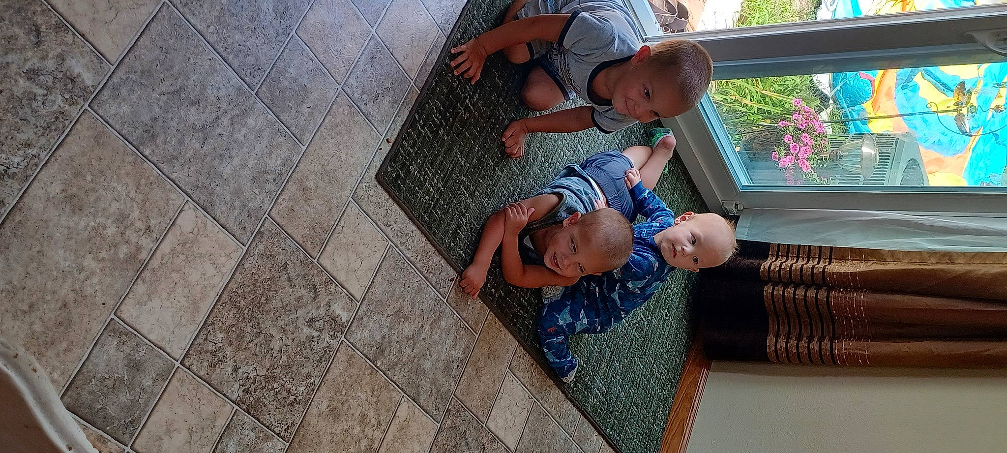 Levi joined the competition — help win amazing prizes! baseball_cap, cap, child, daytime, flooring, fun, hand, hat, house, human_leg, joy, leisure, person, plant, road_surface, shorts, sitting, sun_hat, t_shirt, toddler