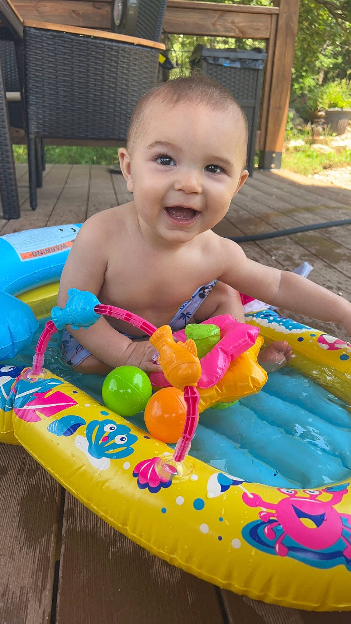 Weston is registered to the contest to win money with this photo: baby, baby_playing_with_toys, baby_products, baby_toys, child, fun, green, happy, inflatable, joy, leisure, people, person, plant, play, recreation, smile, summer, toddler, toy