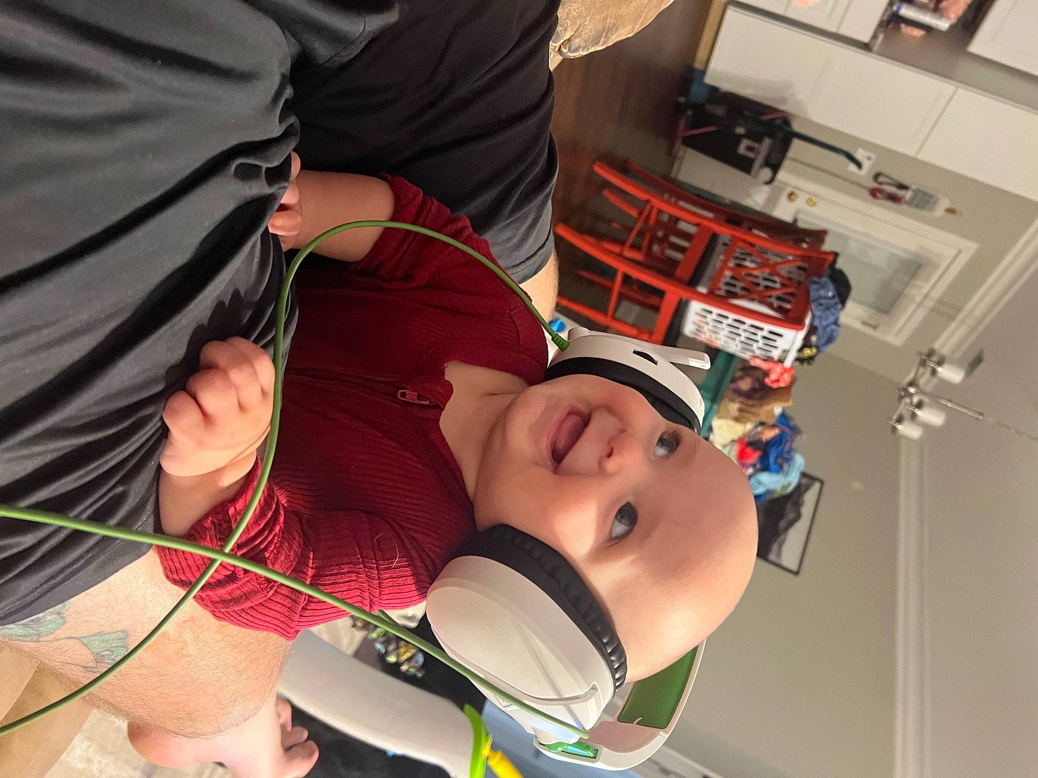 Baylee is registered to the contest to win money with this photo: audio_equipment, baby, chest, child, elbow, eyewear, fashion_accessory, fun, hat, headwear, joy, knee, person, personal_protective_equipment, room, smile, t_shirt, thigh, toddler