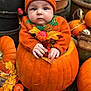 baby, pumpkin, autumn, fall_leaves, orange_sweater, knit_hat, decorative_gourds, outdoor, cute, child, seasonal, harvest, festive, nature, portrait, hands, face, plant_pots, cozy, holiday