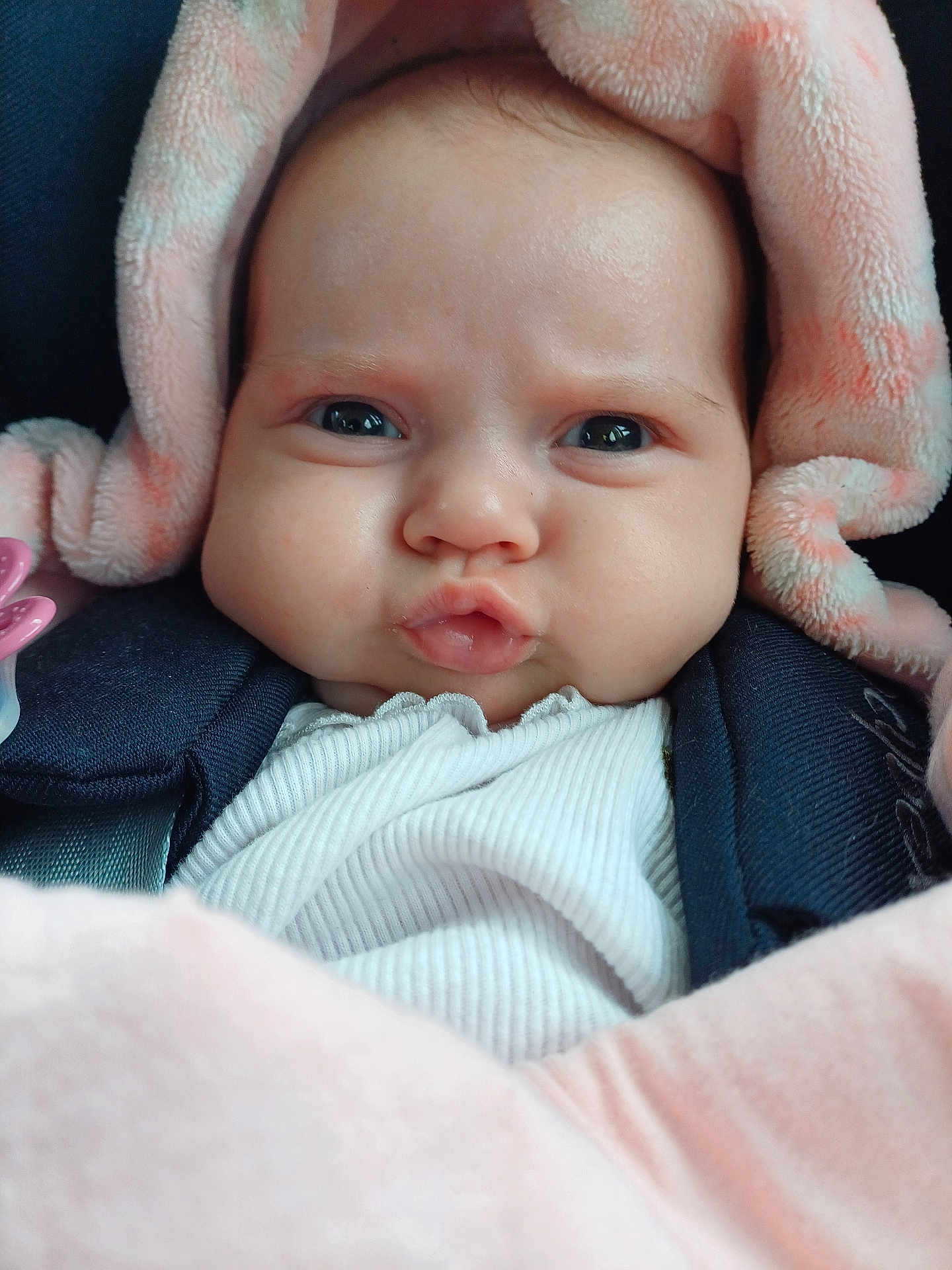 Mia participe au concours pour gagner de l'argent avec cette photo : baby, infant, face, blanket, pink, expression, closeup, cute, child, clothing, warm, soft, pout, looking, head, person, newborn, wrapped, cozy, indoors