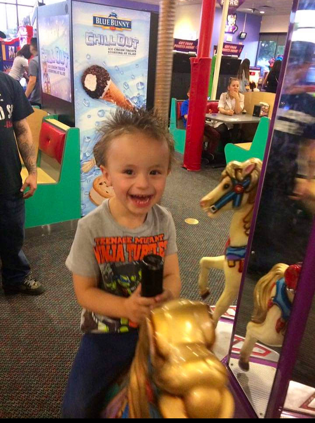 Ayden is registered to the contest to win money with this photo: baby, blurred, child, event, flooring, fun, hairstyle, happy, leisure, person, play, recreation, retail, room, shopping, shorts, smile, standing, t_shirt, toddler