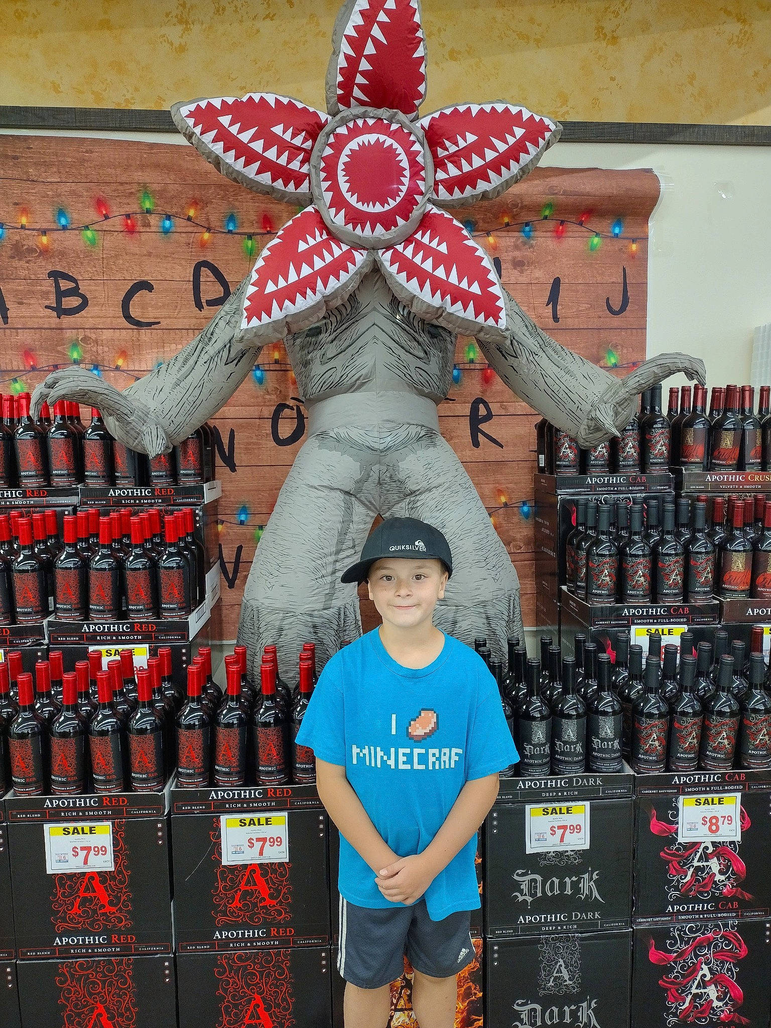 Ayden is registered to the contest to win money with this photo: art, beer, blue, collection, distilled_beverage, drink, event, eyewear, headwear, holiday, joy, machine, pattern, person, retail, shelf, shelving, t_shirt, toy, visual_arts