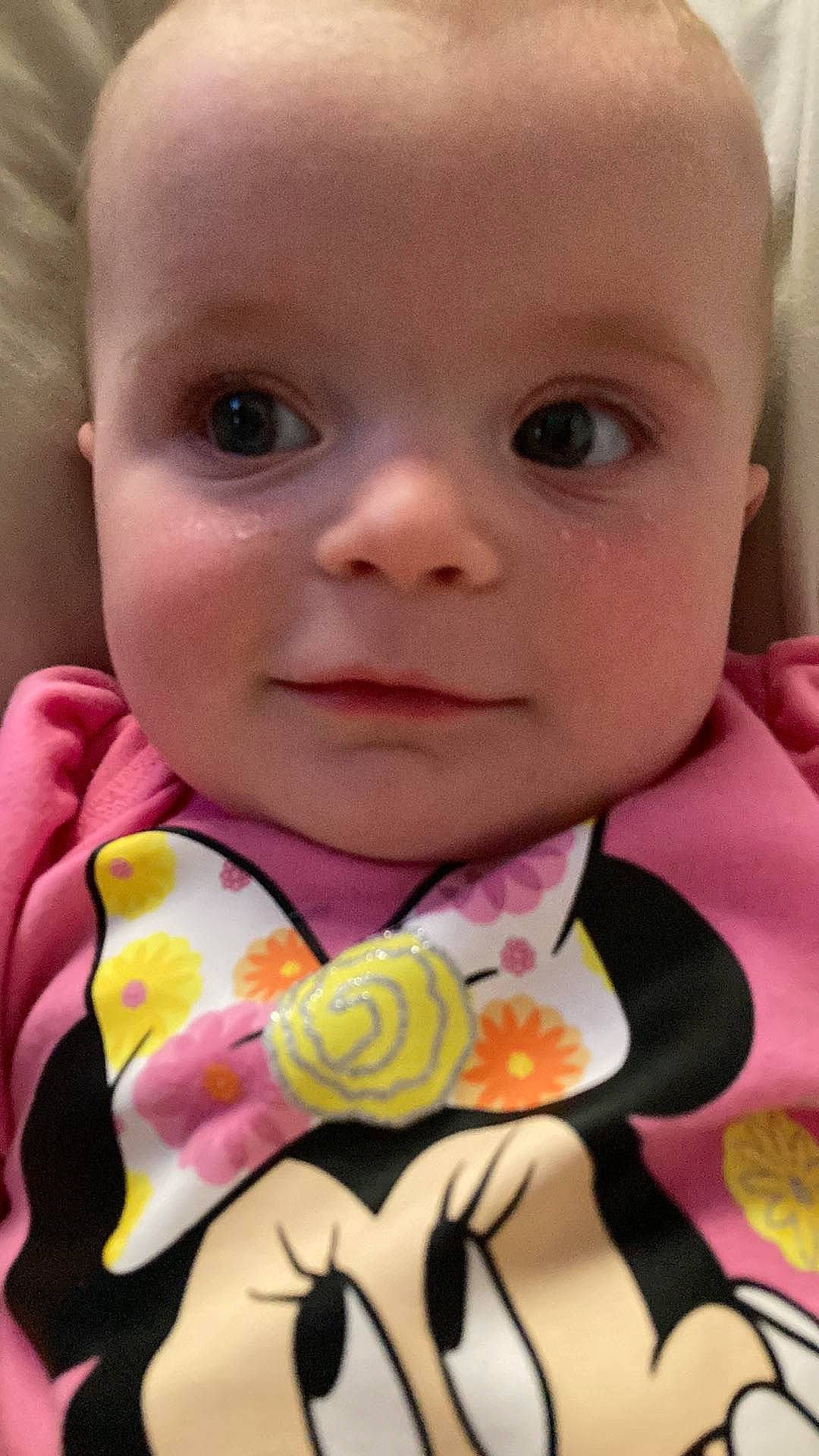 Adeline is registered to the contest to win money with this photo: baby, baby_products, baby_toddler_clothing, cheek, child, chin, close_up, dress, eyebrow, eyelash, happy, iris, linens, lip, nose, person, pink, product, skin, smile