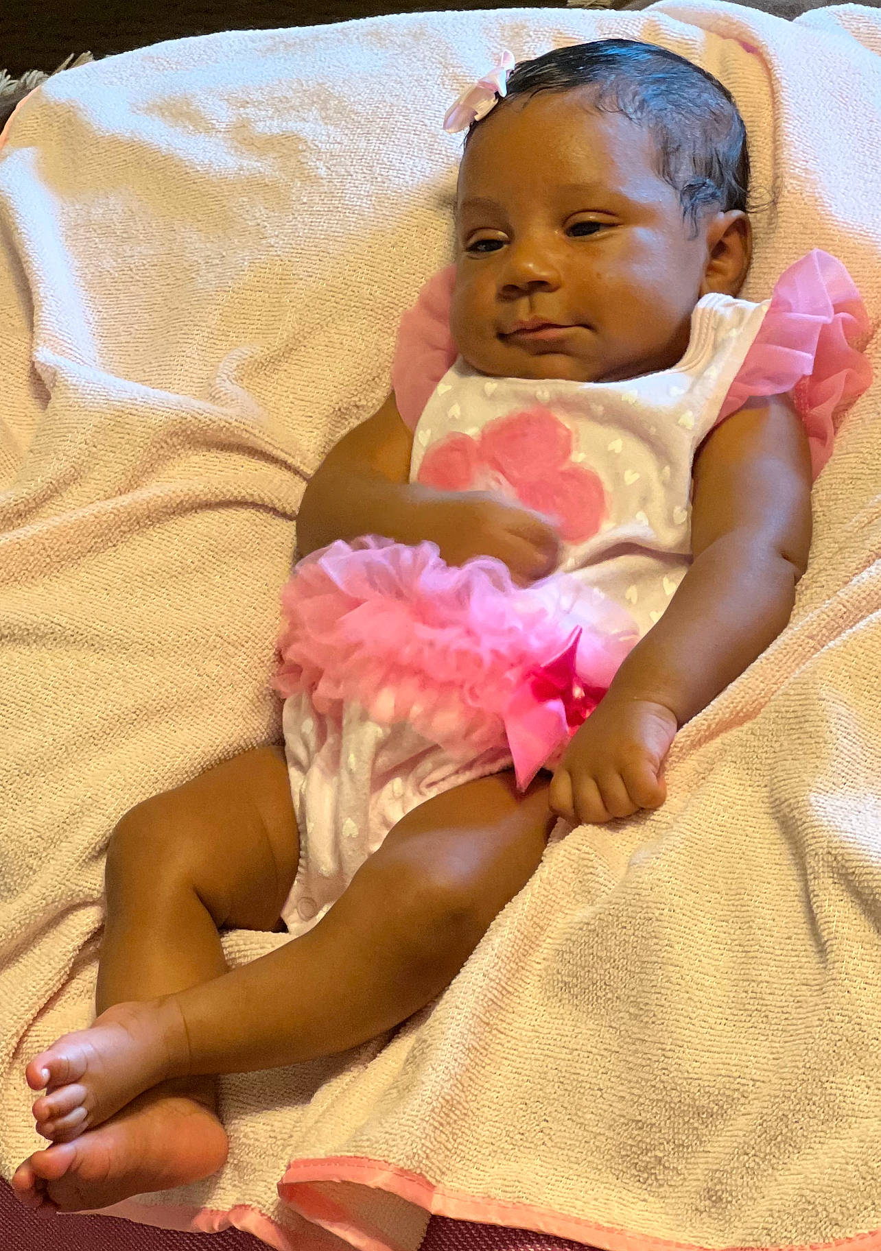 Danyla is registered to the contest to win money with this photo: abdomen, baby, baby_toddler_clothing, child, comfort, dress, event, eye, hair, happy, head, headgear, headpiece, linens, necklace, person, petal, pink, skin, textile