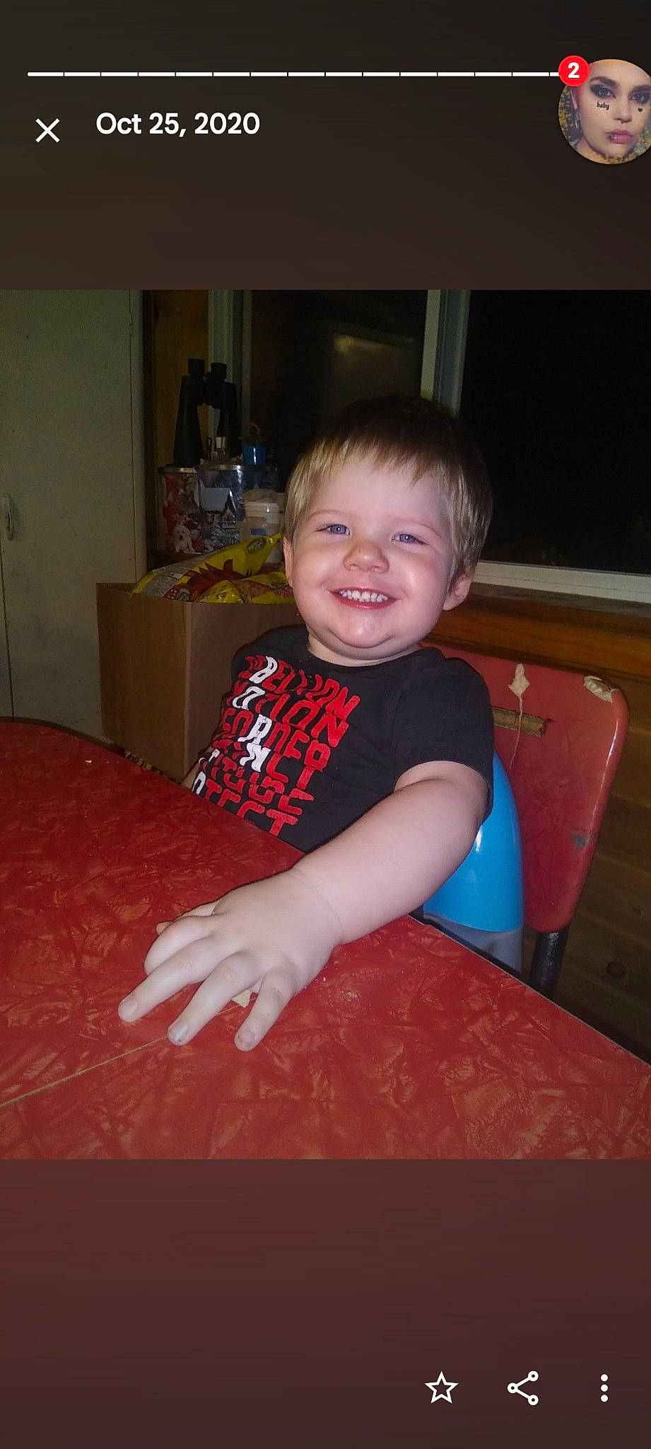 Johnathan is registered to the contest to win money with this photo: cabinetry, chair, child, chin, comfort, drawer, elbow, event, floor, flooring, fun, happy, hardwood, joy, person, shoulder, sitting, sleeve, smile, table