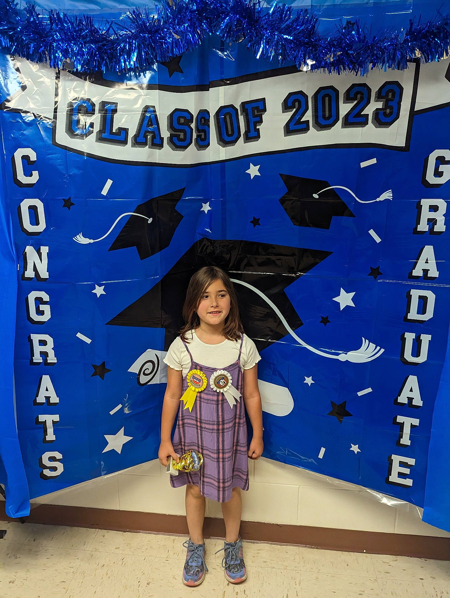 Patricia is registered to the contest to win money with this photo: advertising, azure, banner, blue, child, electric_blue, event, fish, font, happy, joy, mammal, organism, pattern, person, sandal, shorts, sock, t_shirt, toddler