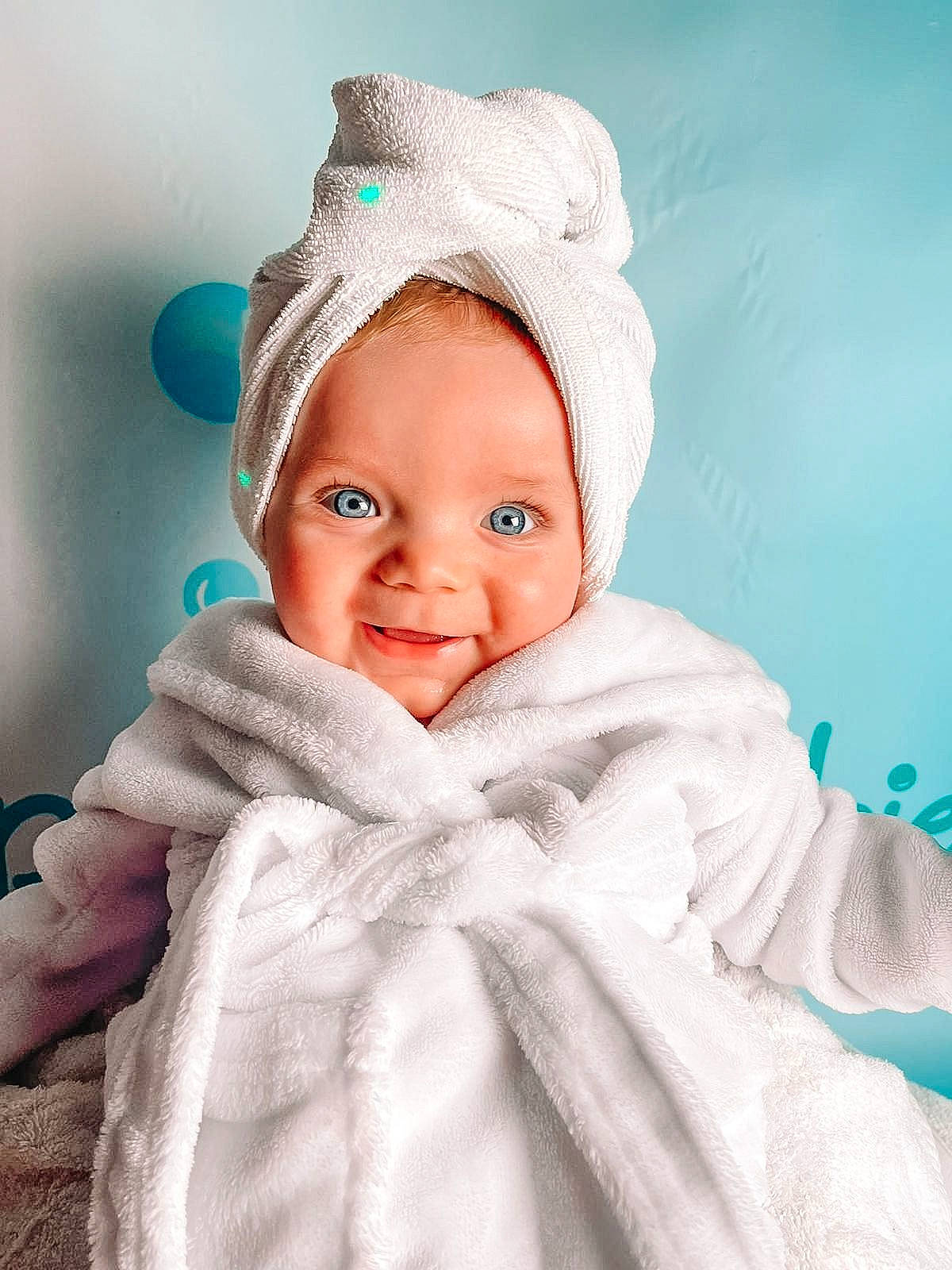 Louie joined the competition — help win amazing prizes! art, azure, baby, cap, cheek, chin, comfort, eye, eyebrow, gesture, happy, headgear, iris, linens, lip, outerwear, person, skin, sleeve, smile