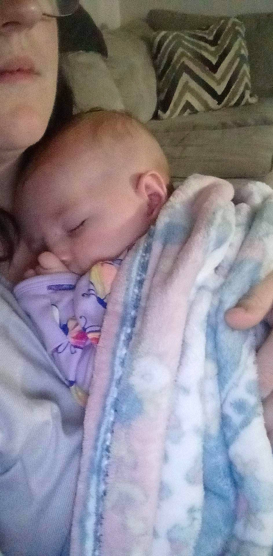 Chloe is registered to the contest to win money with this photo: baby, baby_toddler_clothing, cheek, chin, comfort, ear, eye, eyebrow, finger, gesture, hand, head, human_body, iris, lip, mouth, nose, person, product, skin