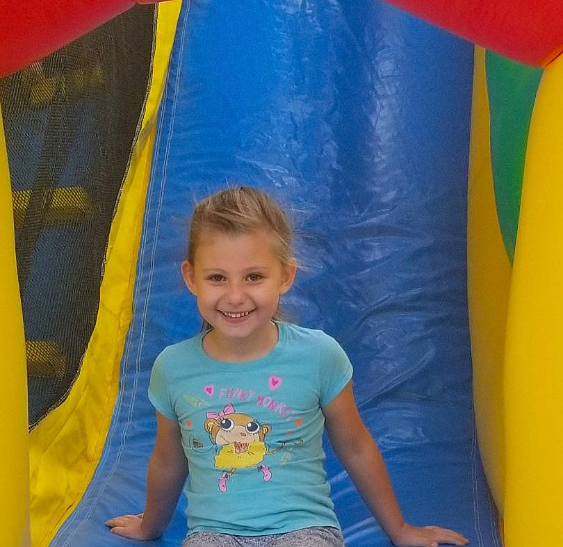 Pyper is registered to the contest to win money with this photo: bounce_house, child, fun, games, inflatable, joy, leisure, outdoor_play_equipment, person, play, recreation, smile, toddler, world, yellow