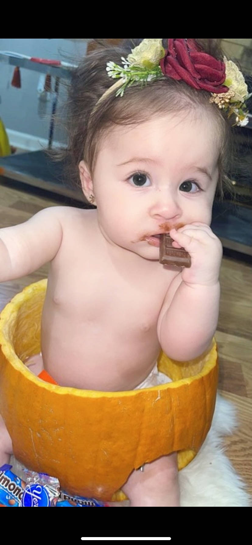 Jenna is registered to the contest to win money with this photo: baby, baby_toddler_clothing, cheek, child, chin, eyelash, face, facial_expression, flowerpot, fun, happy, iris, jewellery, lip, mouth, nose, organ, person, plant, skin