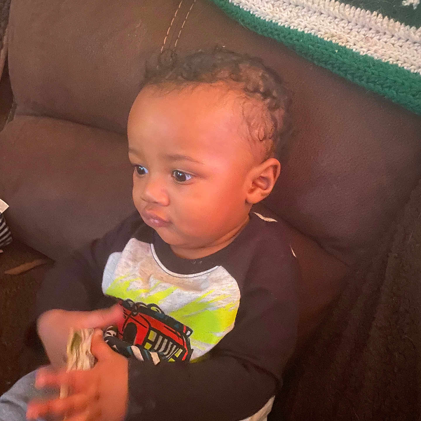 Tchalla is registered to the contest to win money with this photo: accessories, baby, babylaughing, bodypart, bracelet, clothing, couch, face, finger, furniture, hair, hand, happy, head, person, photography, portrait, sitting, smile, t_shirt