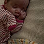 Aurora is registered to the contest to win money with this photo: baby, sleeping, onesie, striped_clothing, blanket, bed, infant, child, soft_texture, hand, face, peaceful, nursery, cute, rest, cozy, indoors, young_child, portrait, comfort