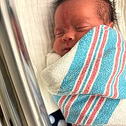 Aurora joined the competition — help win amazing prizes! newborn, baby, sleeping, swaddled, hospital_blanket, crib, polka_dot, face, infant, child, soft, peaceful, resting, portrait, close_up, head, blanket, indoors, cute, tiny