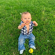 Coda joined the competition — help win amazing prizes! baby, ball, blue_eyes, child, cute, grass, greenery, happy, jeans, nature, outdoor, plaid_shirt, playful, sitting, smiling, socks, sunlight, toddler, tree, yellow_ball