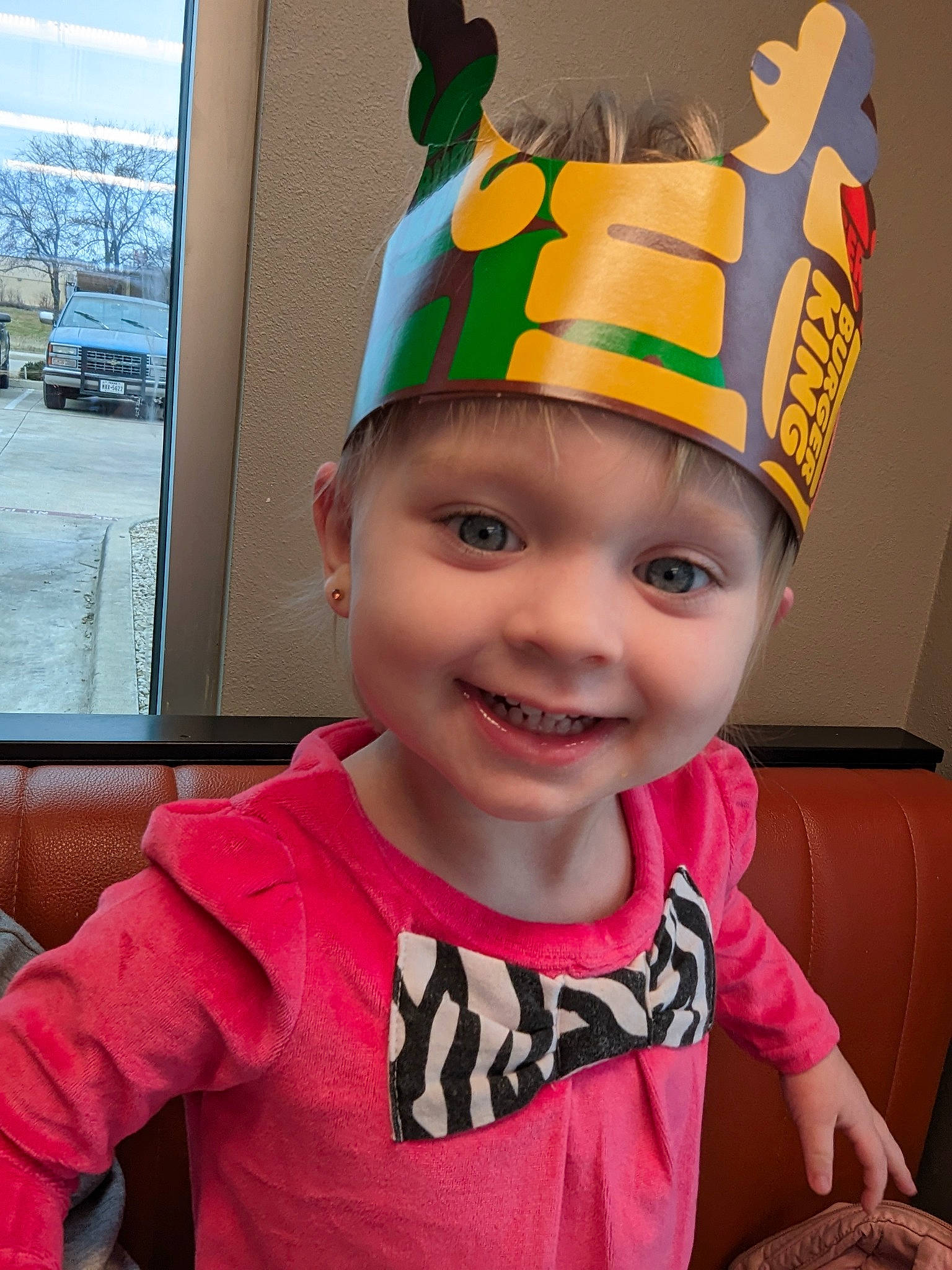 Mckenzie is registered to the contest to win money with this photo: baby_toddler_clothing, baseball_cap, cap, child, cool, costume, costume_hat, face, fashion_accessory, fun, happy, headwear, joy, magenta, party_supply, person, personal_protective_equipment, sleeve, smile, sports_gear