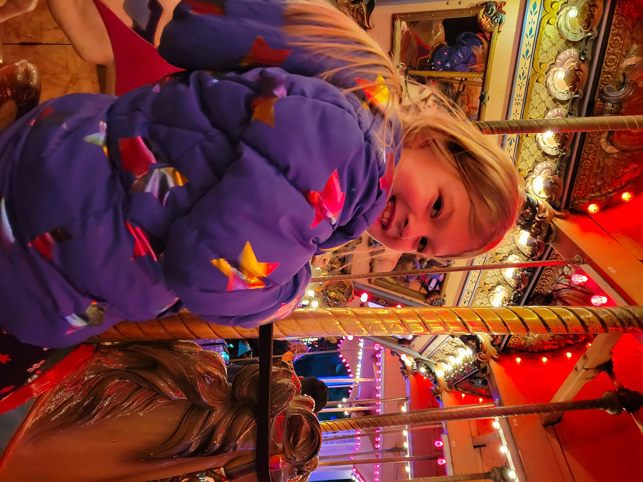 Ava joined the competition — help win amazing prizes! amusement_ride, child, city, electric_blue, event, fun, holiday, joy, leisure, magenta, orange, person, purple, recreation, smile, toddler, tradition, tree